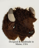 Small plush bison head  on a white background, labeled 'Designed & handmade in Maine, USA'.
