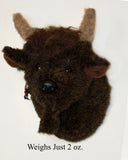 Tiny buffalo mount, Joseph, on white background. Text 'weighs just 2 oz. '
